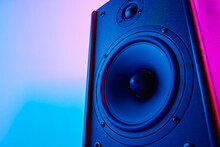 Stereo Speaker On Purple Colored Background. Sound Audio Loud Speaker With Copy Space