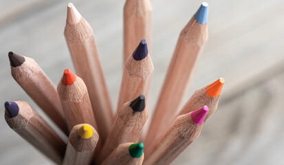 Wall Mural - Close-up of colored pencils on a blurred background.