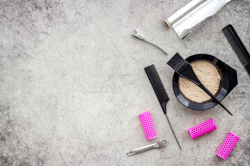 Hair dye mixing bowl with foil and brush. Flat lay