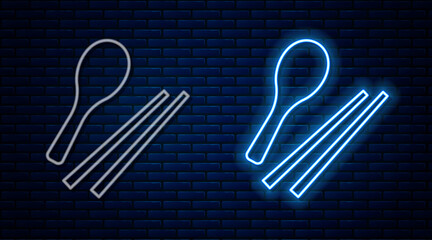 Poster - glowing neon line food chopsticks icon isolated on brick wall background. wooden korean sticks for a