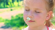 © ElenaEmiliya - Happy little girl smeling  summer flower . Happy child enjoying nature outdoors