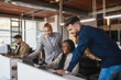 © ADDICTIVE STOCK - Company of multiethnic colleagues working together in office