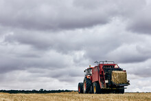 Tractor And Haystack On Field