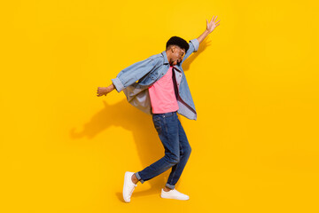 Wall Mural - Full length photo of afro american young happy man dance enjoy free time isolated on yellow color background