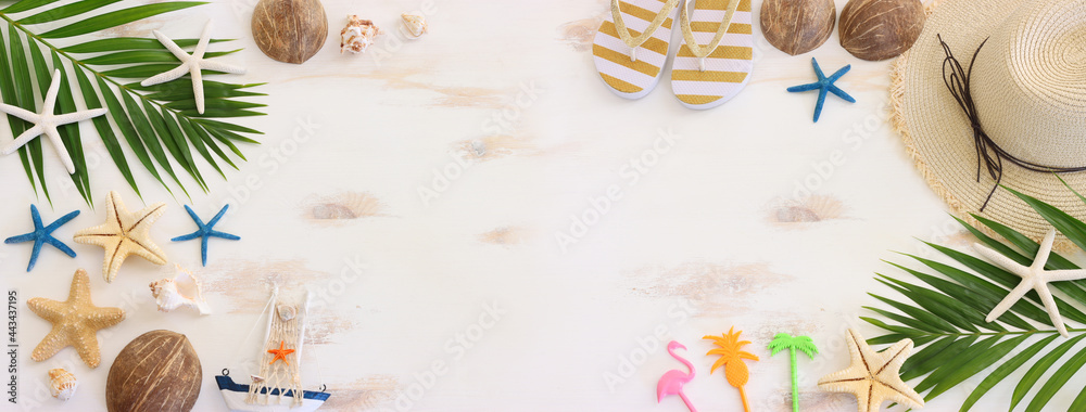 nautical concept with decorative sail boat, seashells over white wooden background - obrazy, fototapety, plakaty 