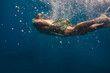 © archimede - Man swimming underwater into the ocean