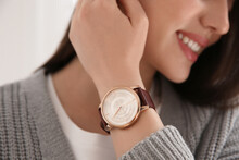 Woman With Luxury Wristwatch On Light Background, Closeup