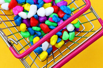 Wall Mural - a lot of colorful candies in shopping cart