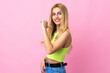 © luismolinero - Young Uruguayan blonde woman over isolated pink background proud and self-satisfied
