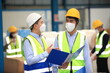 © sittinan - Team workers wear protective face masks for safety industrial factory. worker meeting before start working in factory or warehouse