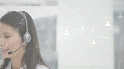 Canvas Print - Animation of networks of connections with icons over businesswoman using phone headsets