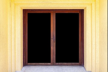 Wall Mural - The large entrance door brown solid wood building and Yellow cement wall