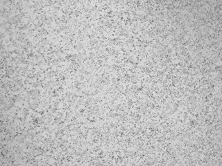 Black and white background, rough texture, looks like a cement floor for background or advertising text.