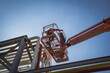 © chitsanupong - Two male  industry working at high in a boom lift