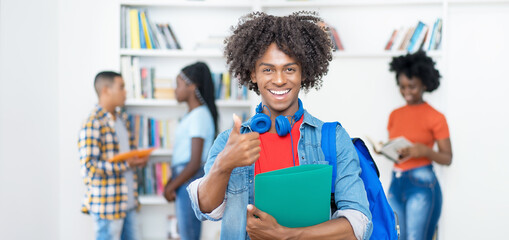 Wall Mural - Successful cheering afro american male college student