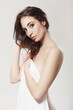 © racool_studio - The beautiful girl is having a photo session in the studio in a night dress.