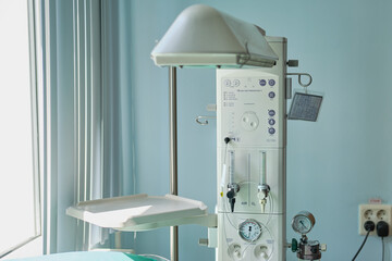 Wall Mural - A device for resuscitation of infants and checking the child on the Apgar scale after delivery. Machine for oxygen supply and resuscitation of the baby after childbirth