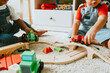 © Rawpixel.com - Little children playing with a railroad train toy