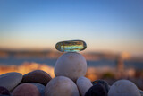 Fototapeta Uliczki - Stacking stones, summer vibes, blur background landscape Lisbon Portugal