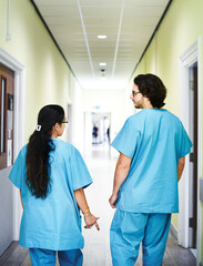 Wall Mural - Colleagues walking down the hospital corridor