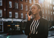 © Rawpixel.com - Woman on the phone while walking