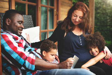 Wall Mural - Mixed race family having fun together