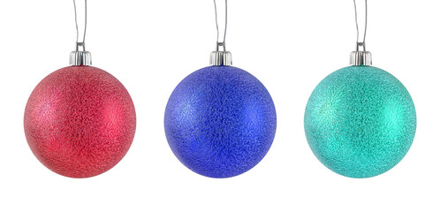 Hanging red, blue, turquoise metallic shiny Christmas baubles set isolated on a white background.