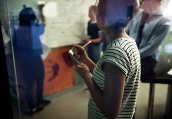 Wall Mural - A group of students giving a presentation