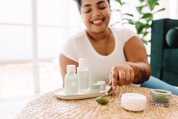 Woman holding jade roller for skin care