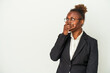 © Asier - Young business african american woman isolated on white background thoughtful looking to a copy space covering mouth with hand.