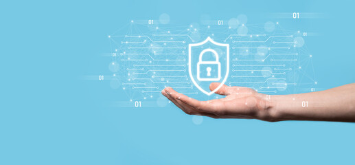 Wall Mural - Protection network security computer and safe your data concept, Businessman holding shield protect icon. lock symbol, concept about security, cybersecurity and protection against dangers