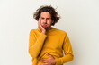 © Asier - Young caucasian man isolated on white background blows cheeks, has tired expression. Facial expression concept.