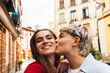 © ADDICTIVE STOCK - Selfie photo of two beauty girls kissing on the cheek