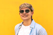© ADDICTIVE STOCK - Young girl with short hair, sunglasses and hair wicks looking at camera