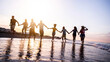 © Davide Angelini - Group of young people running at sunset beach - Happy friends having fun enjoying summer freedom holiday on sea - Friendship, travel, vacations and summertime concept