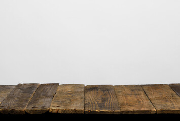 Wall Mural - Empty wooden table top from rustic old wood planks, neutral gray background.