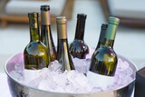 Fototapeta  - White wine bottles in bowl of ice