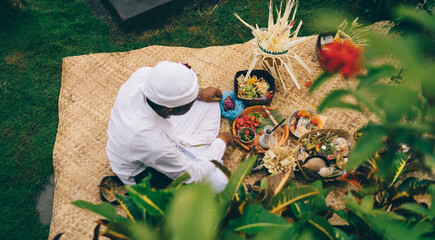 Balinese man performing rite in forest