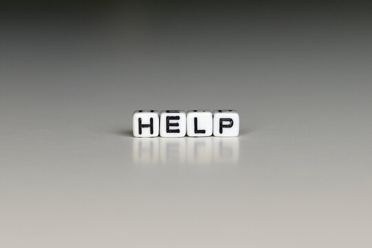 HELP the word written on the white block. HELP text for your design, concept.