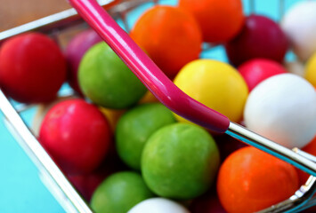 Wall Mural - colored gum balls in a basket