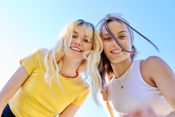 Wall Mural - Close-up of happy smiling faces of teenage girls