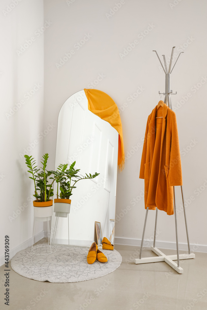 Stylish interior of modern hallway with mirror