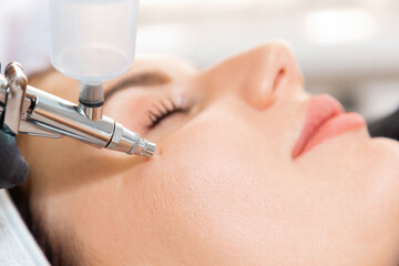 face beauty treatment. close up of client's face getting gas-liquid oxygen water epidermal peeling u