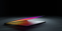 3D Rendering Illustration. Laptop Computer With Colorful Screen And Keyboard Close Lid Place In The Darkroom And Lighting Effect. Image For Presentation.