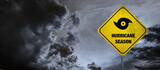 Fototapeta  - Hurricane season banner with storm clouds background.