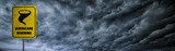 Fototapeta  - Hurricane warning banner with storm clouds background.