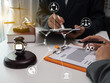 © aekachai - Male lawyer or judge consult having team meeting with client, Law and Legal services concept with icons lawyer