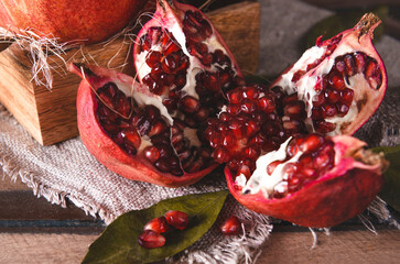 Wall Mural - red ripe  pomegranate on a napkin  top view