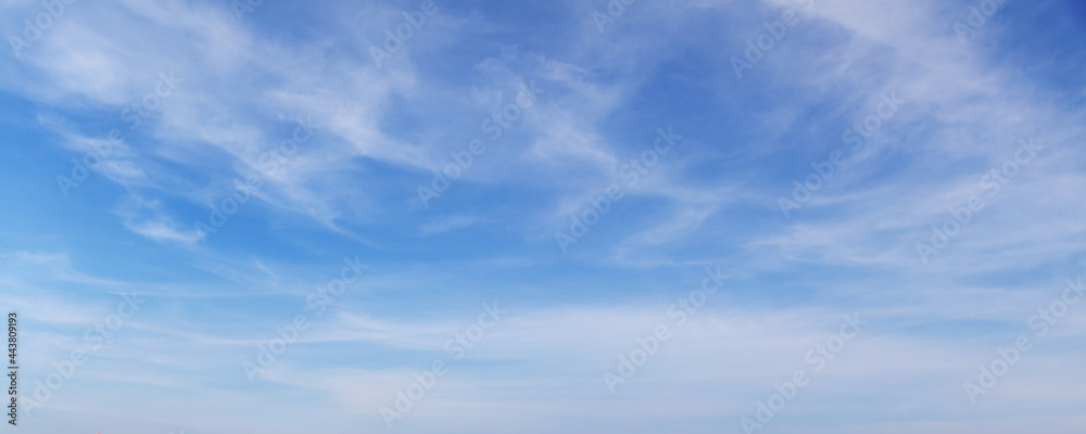 Blue sky with white cirrus clouds on a daytime, background - obrazy, fototapety, plakaty 