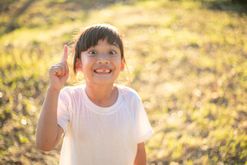 Portrait of cute girl thump up